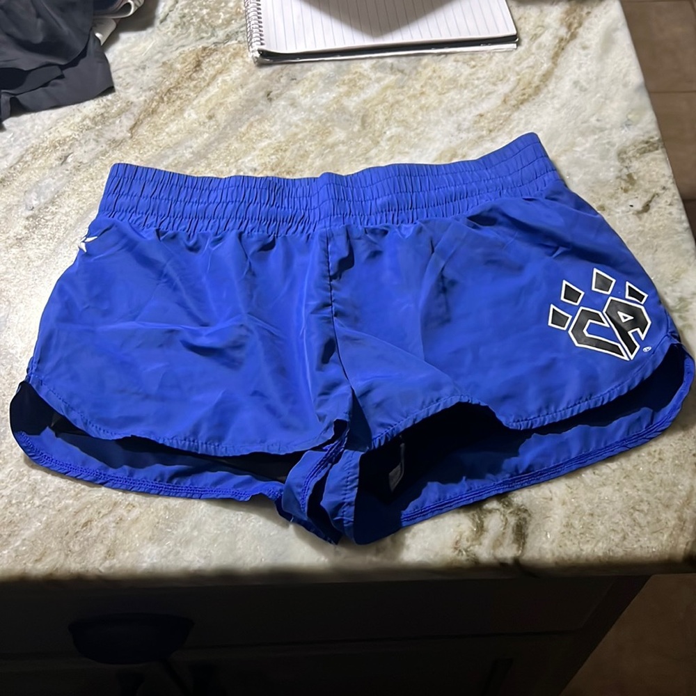 Rebel brand Cheer Athletics blue practice wear shorts .NWOT YXL